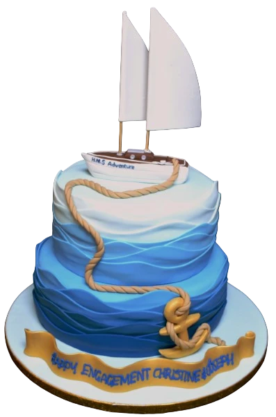 Bespoke sailing-themed cake with wavy blue and white icing, perfect for celebration in Solihull, West Midlands.
