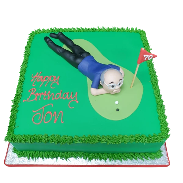 Succulent golf-themed cake with green fairway and golfer figure on top, perfect for golf enthusiasts. Great for sports-themed celebrations.