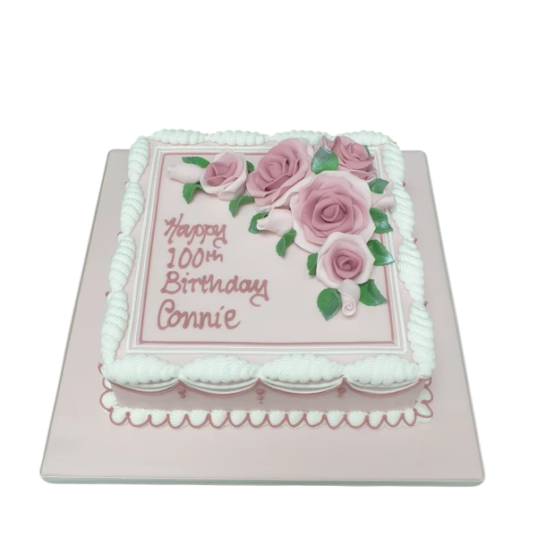 Bespoke celebration cake with intricate floral icing design, crafted in Solihull, West Midlands.