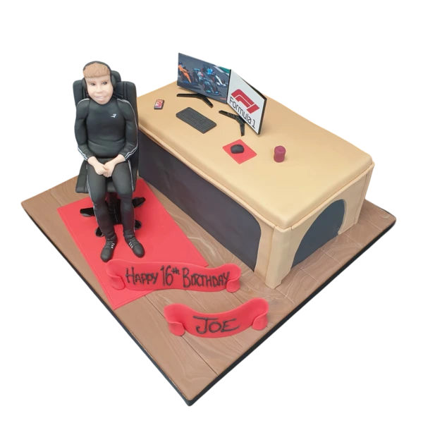 Bespoke cake featuring a gamer boy at desk design, crafted for a celebration in Solihull, West Midlands.