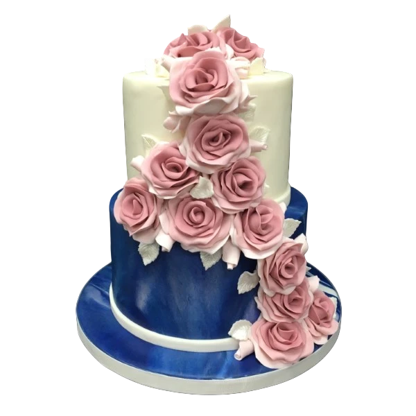 Two-tier wedding cake with cascading pink sugar paste roses and blue accents.