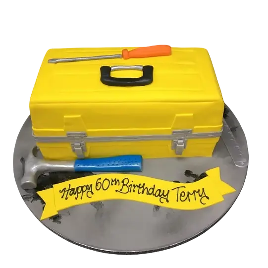Bespoke toolbox cake with realistic tools and wood grain detailing, crafted for celebration in Solihull, West Midlands.
