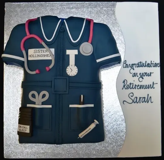 Bespoke nurse tunic cake with detailed collar and buttons, crafted for a celebration in Solihull, West Midlands.