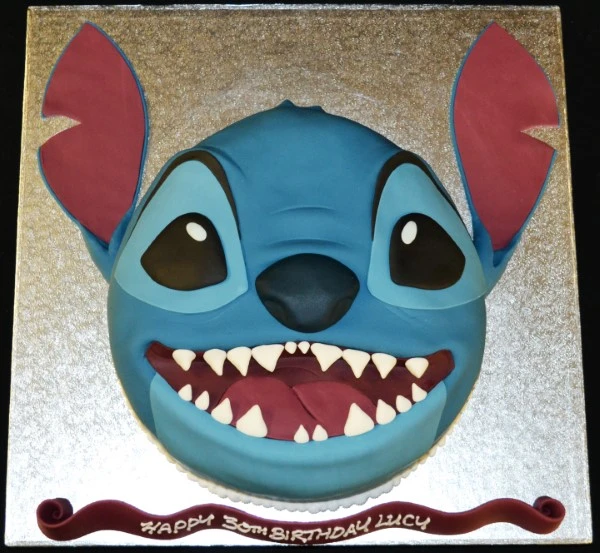 Bespoke Stitch head cake with detailed blue and purple icing, perfect for celebration in Solihull, West Midlands.