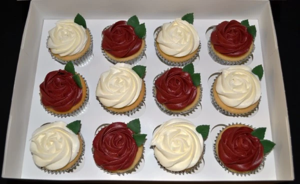 Bespoke rose cupcakes with pink frosting and delicate sugar petals, perfect for celebration in Solihull, West Midlands.