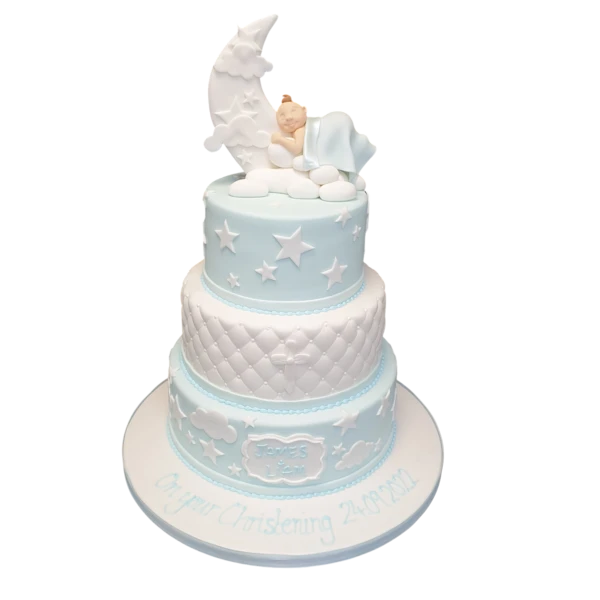 Elegant moon-themed christening cake with intricate detailing and pastel colours, perfect for celebrating a baby's special day.