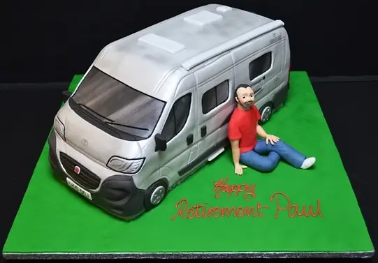 Bespoke cake featuring a detailed camping van and man, crafted for a celebration in Solihull, West Midlands.