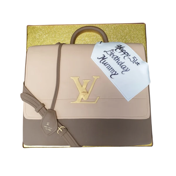 Bespoke cake shaped like a Louis Vuitton handbag with detailed monogram pattern, crafted in Solihull, West Midlands.