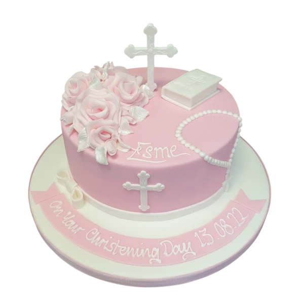Bespoke christening cake with white icing, delicate blue floral accents, and a silver cross topper in Solihull, West Midlands.