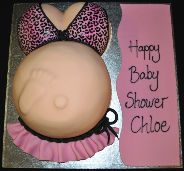 A beautifully crafted pregnant belly cake perfect for baby showers and gender reveal parties, delicately decorated and elegantly designed.