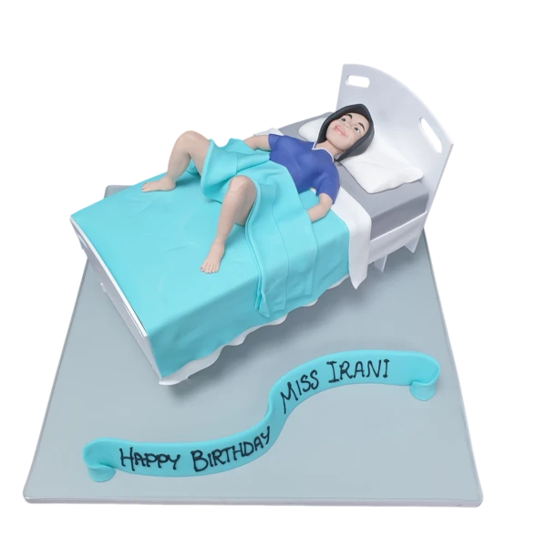 Decorated gynaecology bed hospital cake for a special occasion. Perfect for medical professionals or healthcare-themed events.