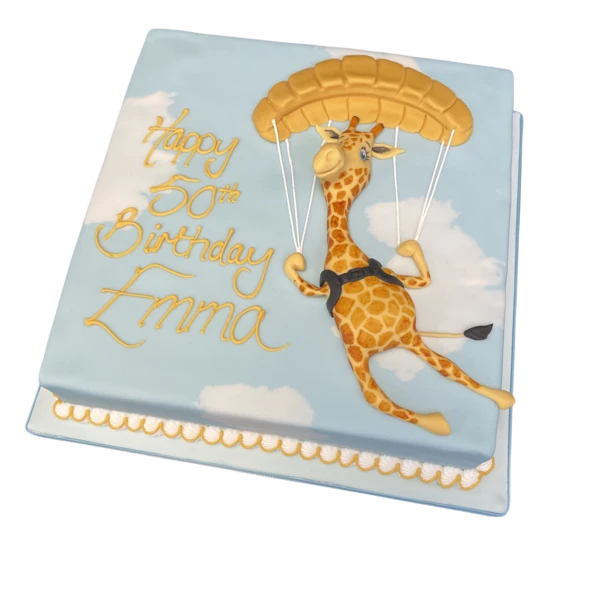 Bespoke celebration cake featuring a parachuting giraffe design in Solihull, West Midlands.