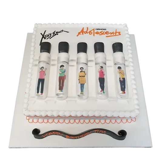 Bespoke cake featuring XRAY SPEX album cover design with bold graphics, crafted in Solihull, West Midlands.