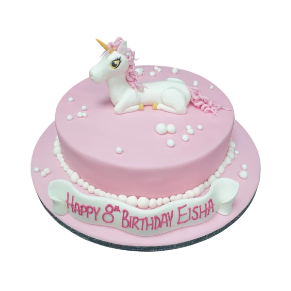 A whimsical unicorn-themed cake with pastel colors and edible fondant decorations, perfect for a magical celebration or party in UK.