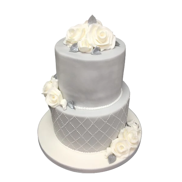 Two-tier wedding cake with white sugar paste, roses, and silver accents.
