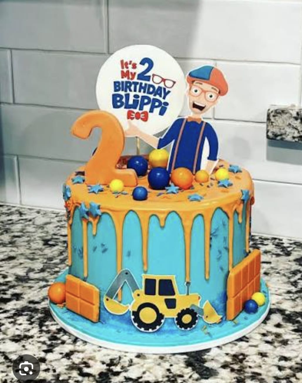 Bespoke celebration cake with intricate floral icing and gold accents in Solihull, West Midlands.