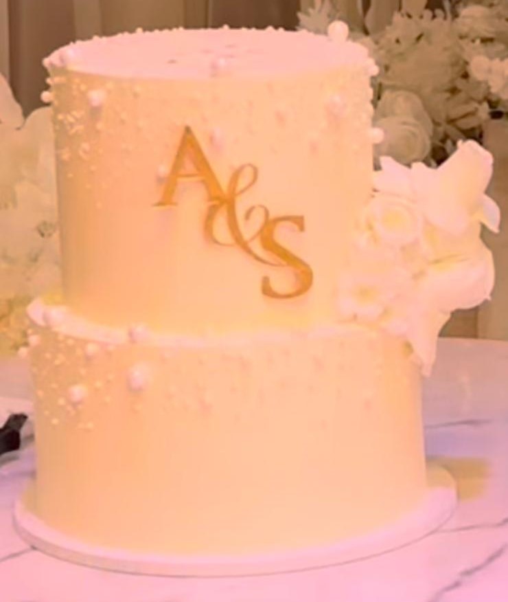 Bespoke celebration cake with intricate floral design and gold accents in Solihull, West Midlands.