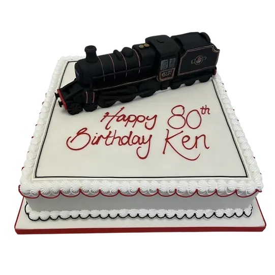 Bespoke model steam train cake with detailed wheels and smokestack, crafted for celebration in Solihull, West Midlands.