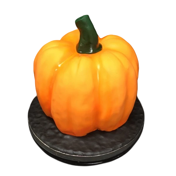 Bespoke pumpkin-shaped cake with intricate orange icing and green vine details, crafted in Solihull, West Midlands.