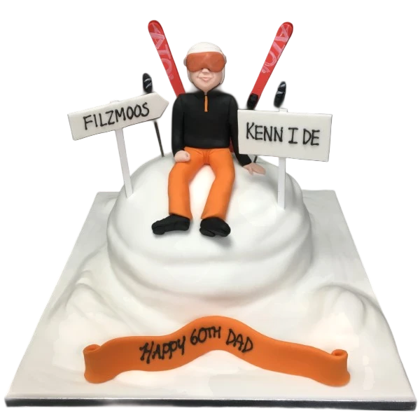 A beautifully decorated ski-themed cake, perfect for winter sports enthusiasts and snow lovers.