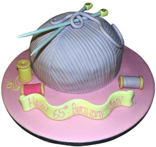 Bespoke cake shaped like a colorful ball of wool with textured yarn details, made in Solihull, West Midlands.