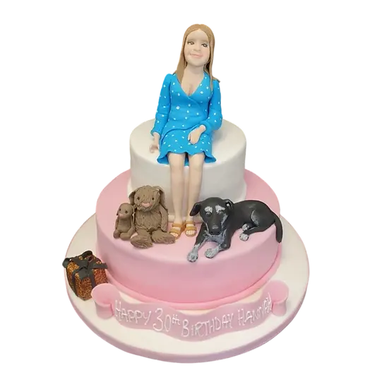Bespoke cake in Solihull, West Midlands featuring a lady with a dog and toy bunnies for celebration.