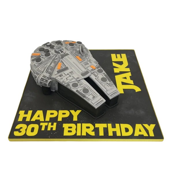 Bespoke Millennium Falcon cake with intricate Star Wars details, crafted in Solihull, West Midlands for celebration.