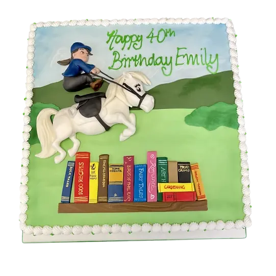 Bespoke cake featuring a Thelwell style horse jumping over books, crafted in Solihull, West Midlands.