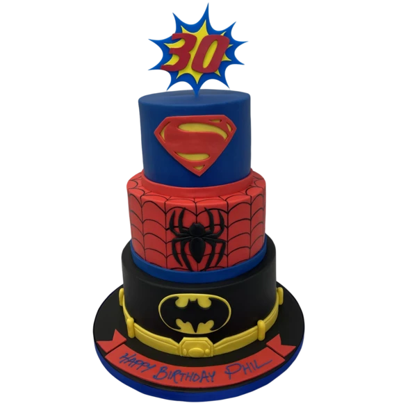Bespoke celebration cake featuring detailed Superman, Spiderman, and Batman figures in Solihull, West Midlands.