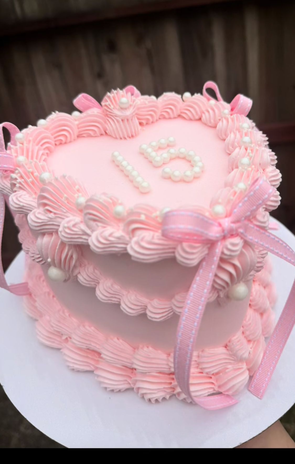 Bespoke two-tier celebration cake with intricate floral icing, personalized message, Solihull, West Midlands.