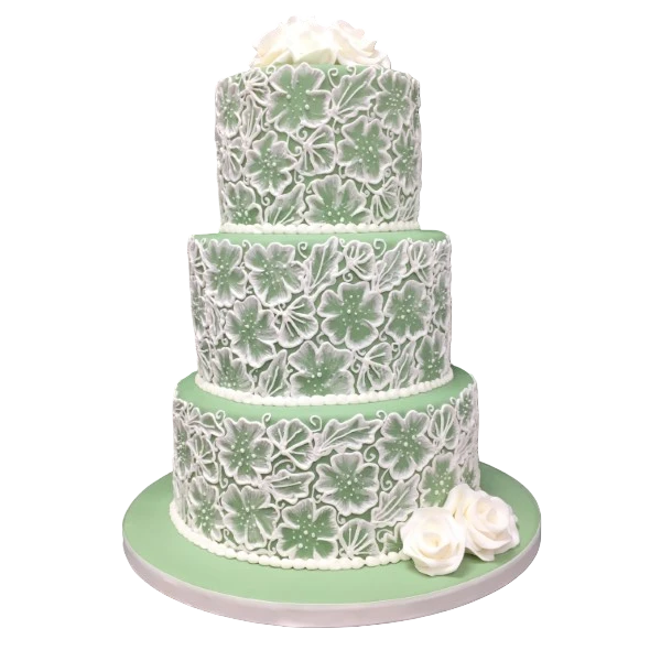 Elegant three-tiered wedding cake with green sugar paste and white floral designs.
