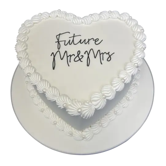 Bespoke cake with a simple heart design and large shell decorations, crafted in Solihull, West Midlands.