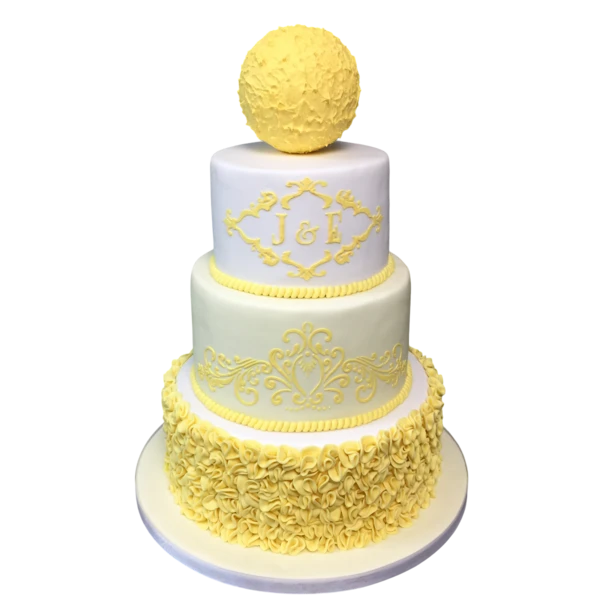 Four-tiered wedding cake with yellow sphere, intricate designs, and sugar paste ruffles.
