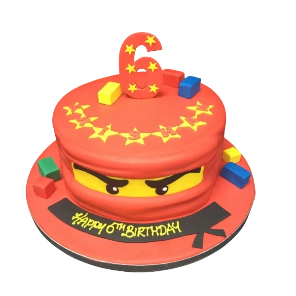 Bespoke Ninjago Lego Head cake with vibrant colors and detailed features for celebration in Solihull, West Midlands.