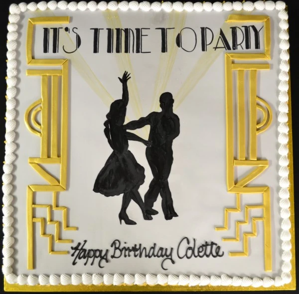 A beautifully crafted cake featuring intricate ballet dancers in graceful poses against a backdrop of squares, perfect for any dance enthusiast's celebration.