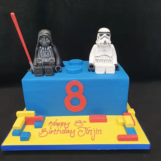 Bespoke Lego brick cake featuring Darth Vader and Storm Trooper figures, crafted in Solihull, West Midlands.