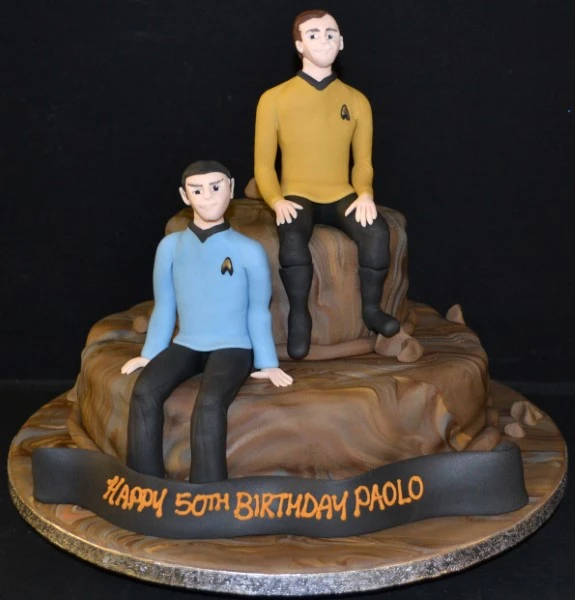 Bespoke Star Trek duo cake with detailed spaceship and emblem decorations, crafted in Solihull, West Midlands.