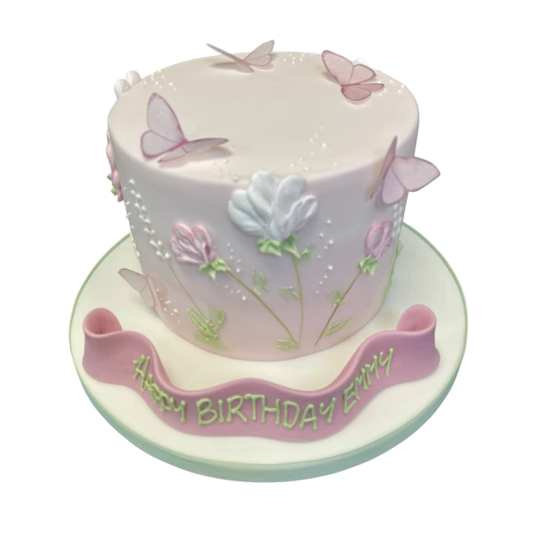 A stunning celebration cake adorned with delicate flowers and butterflies, perfect for adding a touch of natural beauty to any special occasion.
