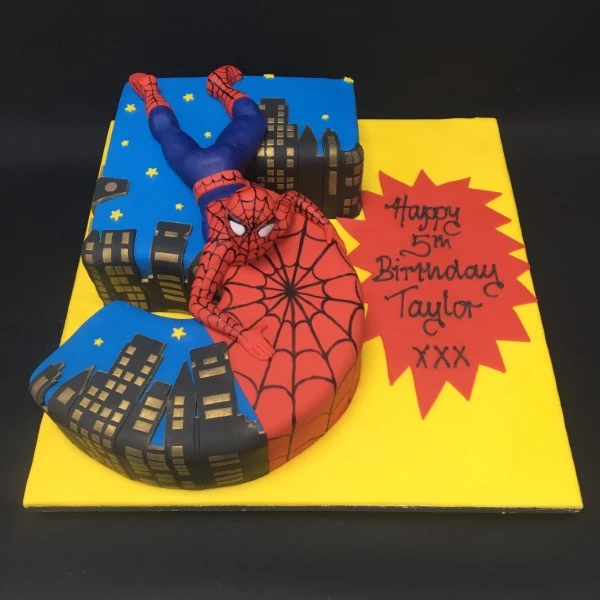Bespoke Spider-Man celebration cake with red and blue web design, displayed in Solihull, West Midlands.