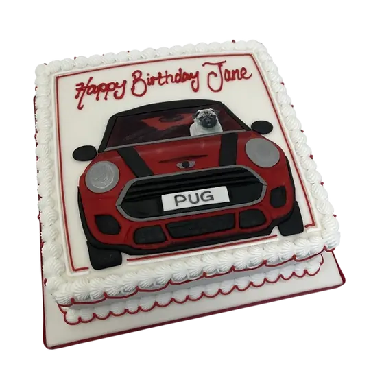 Bespoke cake featuring a detailed pug in a mini car design, crafted for celebration in Solihull, West Midlands.