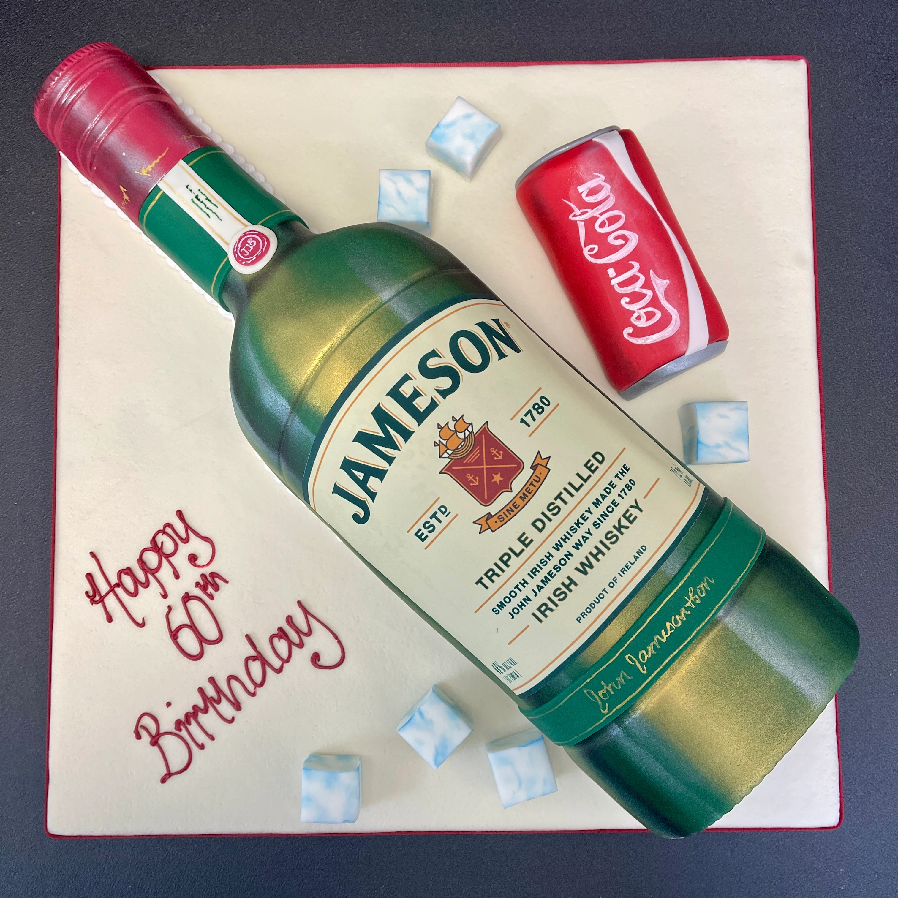 Bespoke celebration cake with intricate floral icing design, personalized message, in Solihull, West Midlands.