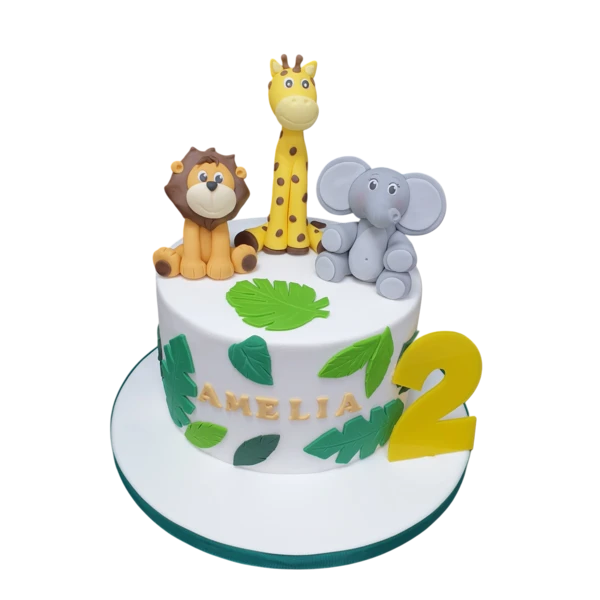 Adorable animal-themed cake featuring a lion, giraffe, and elephant decoration. Perfect for a fun and playful celebration.