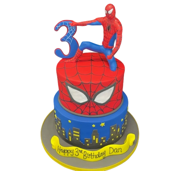 Bespoke Spiderman-themed cake with red and blue web design, featuring a 3D Spiderman figure in Solihull, West Midlands.