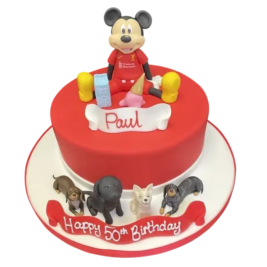 Bespoke celebration cake in Solihull, West Midlands featuring Mickey Liverpool and dogs figurines on top.