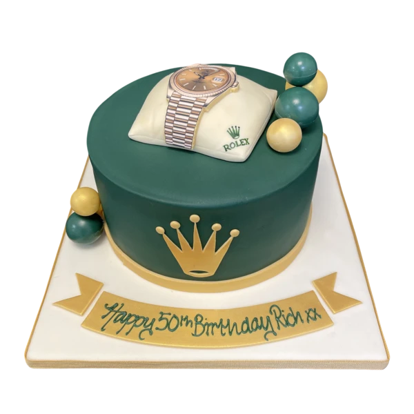 Bespoke Rolex Cushion cake with green fondant and gold detailing, crafted in Solihull, West Midlands for celebration.