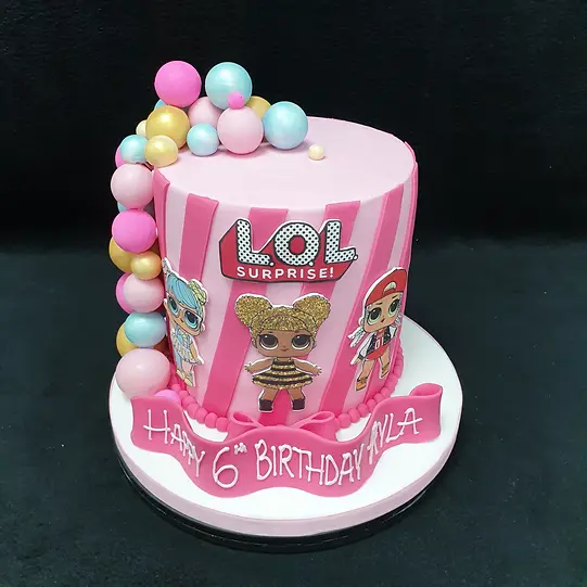 Bespoke LOL Surprise-themed cake with colorful decorations, perfect for celebration in Solihull, West Midlands.