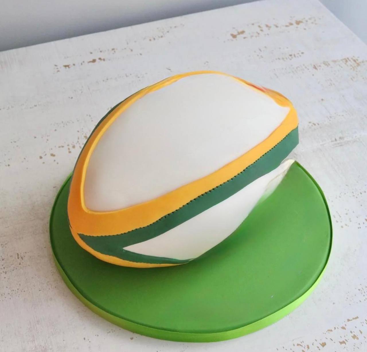 Bespoke celebration cake with intricate floral icing and elegant piping, crafted in Solihull, West Midlands.