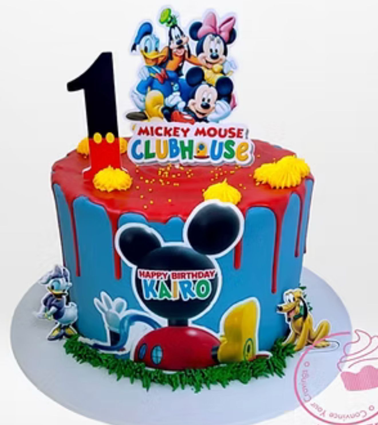 Bespoke celebration cake with intricate floral icing and gold accents, crafted in Solihull, West Midlands.