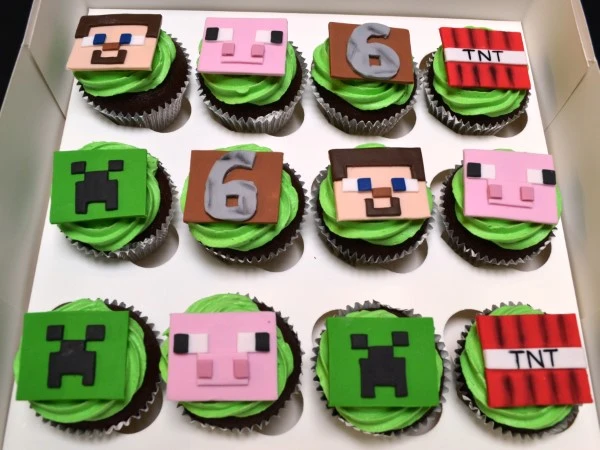 Colorful Minecraft-themed cupcakes with pixelated decorations perfect for gamers or themed parties.