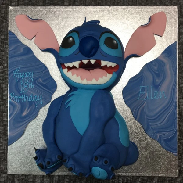 Bespoke Stitch-themed cake with vibrant blue and purple icing, detailed character design, in Solihull, West Midlands.